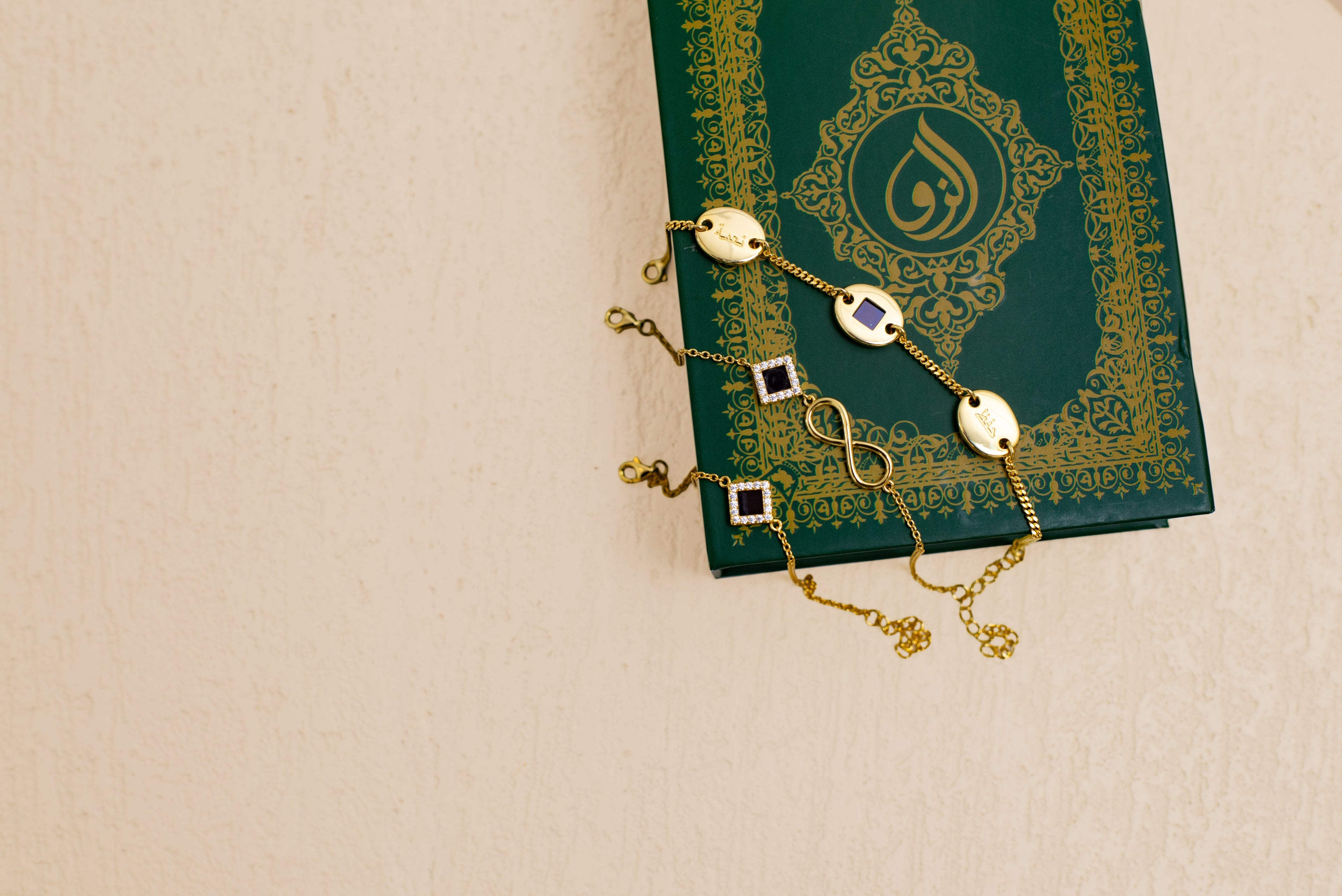 few of nur bracelet on there box with a beige background 
