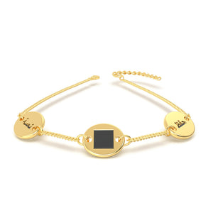 Gold bracelet with three round-and-square pendants, featuring a central square black nano chip inscribed with the entire Quran, displayed on a white background.
