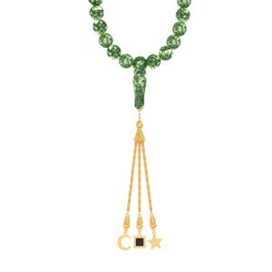 Green gemstone tasbih with triple gold tassels, designed with an embedded nano chip containing the full Quran in micro engraving.