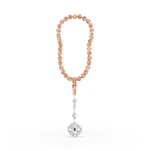 Refined tasbih with pink and white stones and a decorative white-gold pendant, containing a nano chip engraved with the entire Quran in micro detail.