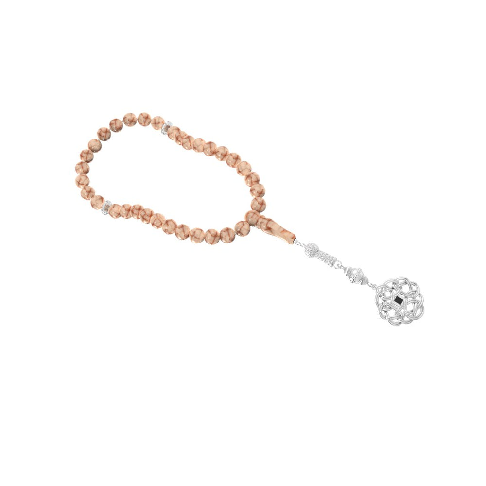 Refined tasbih with pink and white stones and a decorative white-gold pendant, containing a nano chip engraved with the entire Quran in micro detail.