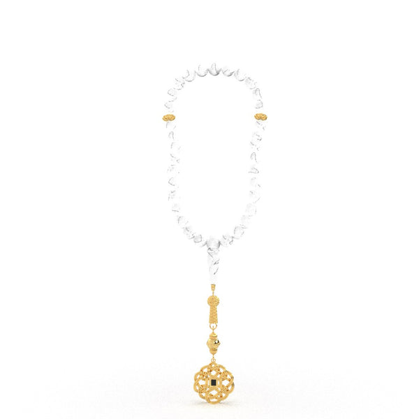 Gold tasbih with white stones and a decorative gold pendant featuring a nano chip micro-engraved with the entire Quran.