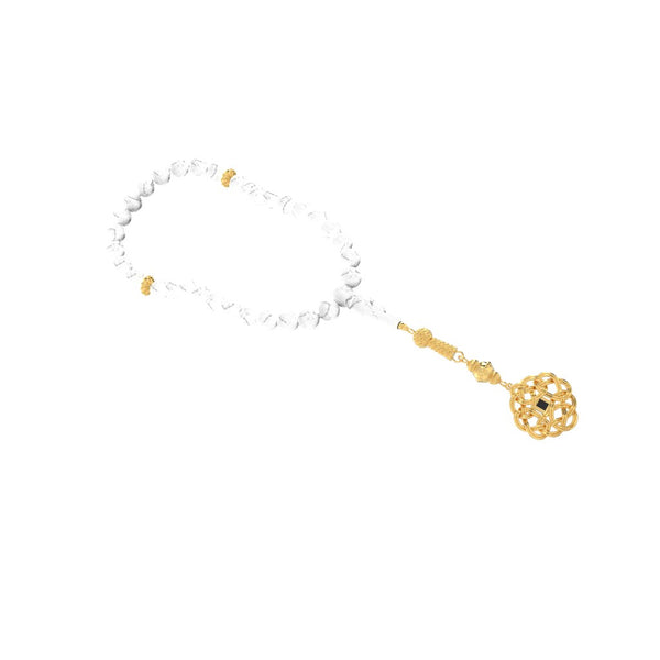 Gold tasbih with white stones and a decorative gold pendant featuring a nano chip micro engraved with the entire Quran.