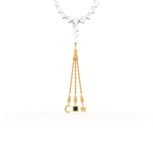 Gold tasbih with white stones and a gold pendant containing a Quran-inscribed nano chip, displayed on a white background.