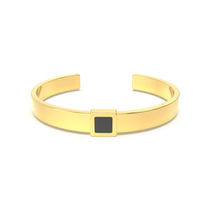Gold cuff bracelet featuring a built-in black nano chip containing the full Quran, displayed on a white background.