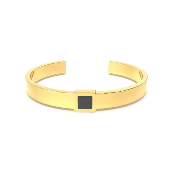 Gold cuff bracelet featuring a built-in black nano chip containing the full Quran, displayed on a white background.
