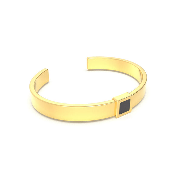 Gold cuff bracelet featuring a built-in black nano chip containing the full Quran, displayed on a white background.