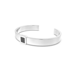 Silver cuff bracelet featuring a built-in black nano chip containing the full Quran, displayed on a white background.