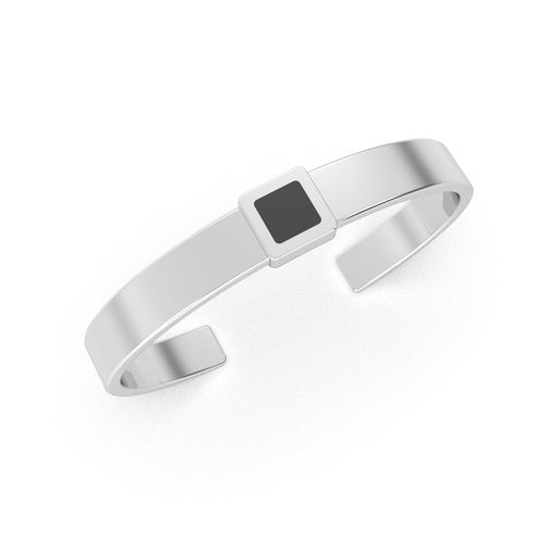 Silver cuff bracelet featuring a built-in black nano chip containing the full Quran, displayed on a white background.