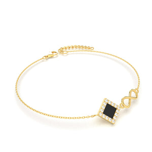 Gold bracelet with an intertwined side design and a central square pendant containing a black nano chip inscribed with the entire Quran, displayed on a white background.