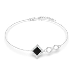Silver bracelet with an intertwined side design and a central square pendant containing a black nano chip inscribed with the entire Quran, displayed on a white background.