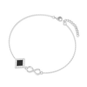 Silver bracelet with an intertwined side design and a central square pendant containing a black nano chip inscribed with the entire Quran, displayed on a white background.