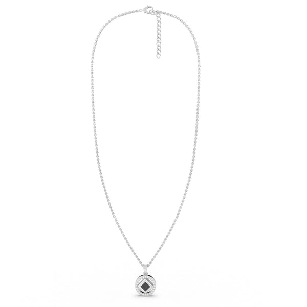 Elegant silver necklace with a round pendant featuring a black center stone and a nano chip micro-engraved with the entire Quran.