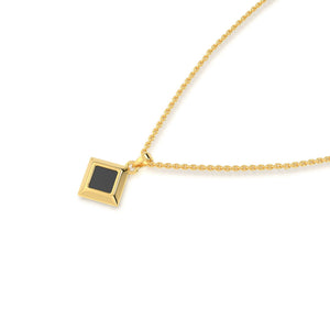 Gold necklace with a square black nano-chip pendant containing a Quran-inscribed nano chip, displayed on a white background.