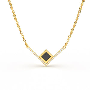 Gold necklace with an intertwined pendant featuring a square black nano chip containing the full Quran, displayed on a white background.