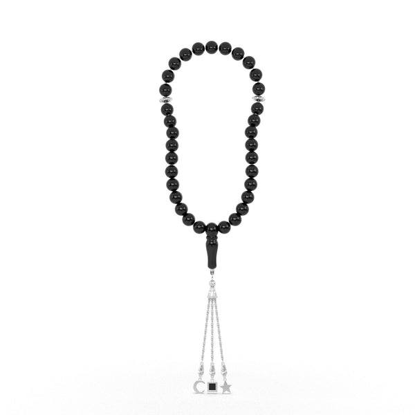 Silver tasbih with black beads and a silver tassel featuring three pendants, with the central square pendant containing a black nano chip inscribed with the entire Quran, displayed on a white background.
