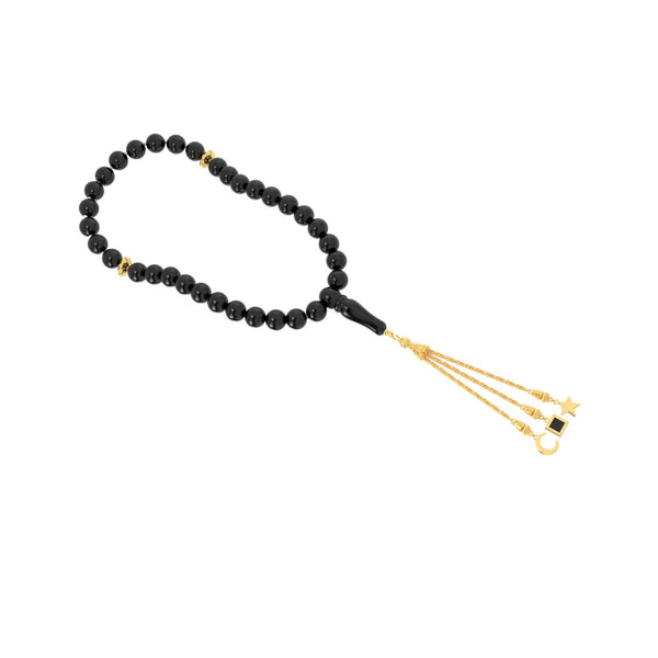 Gold tasbih with black beads and a gold tassel featuring three pendants, with the central square pendant containing a black nano chip inscribed with the entire Quran, displayed on a white background.