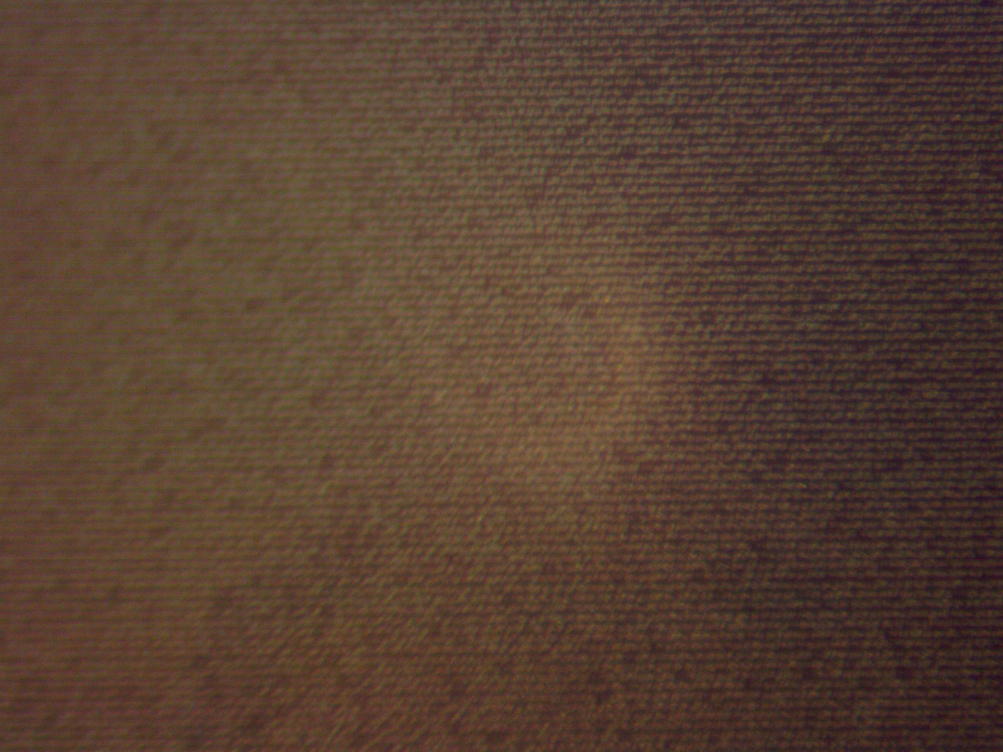 Microscopic close-up view of our black nano chip engraved with the entire Quran.