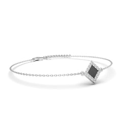 Silver bracelet with a square black nano-chip charm containing the full Quran, displayed on a white background.
