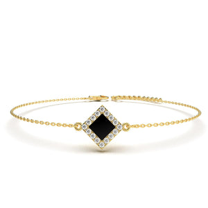 Gold bracelet with a square black nano-chip charm containing the full Quran, displayed on a white background.